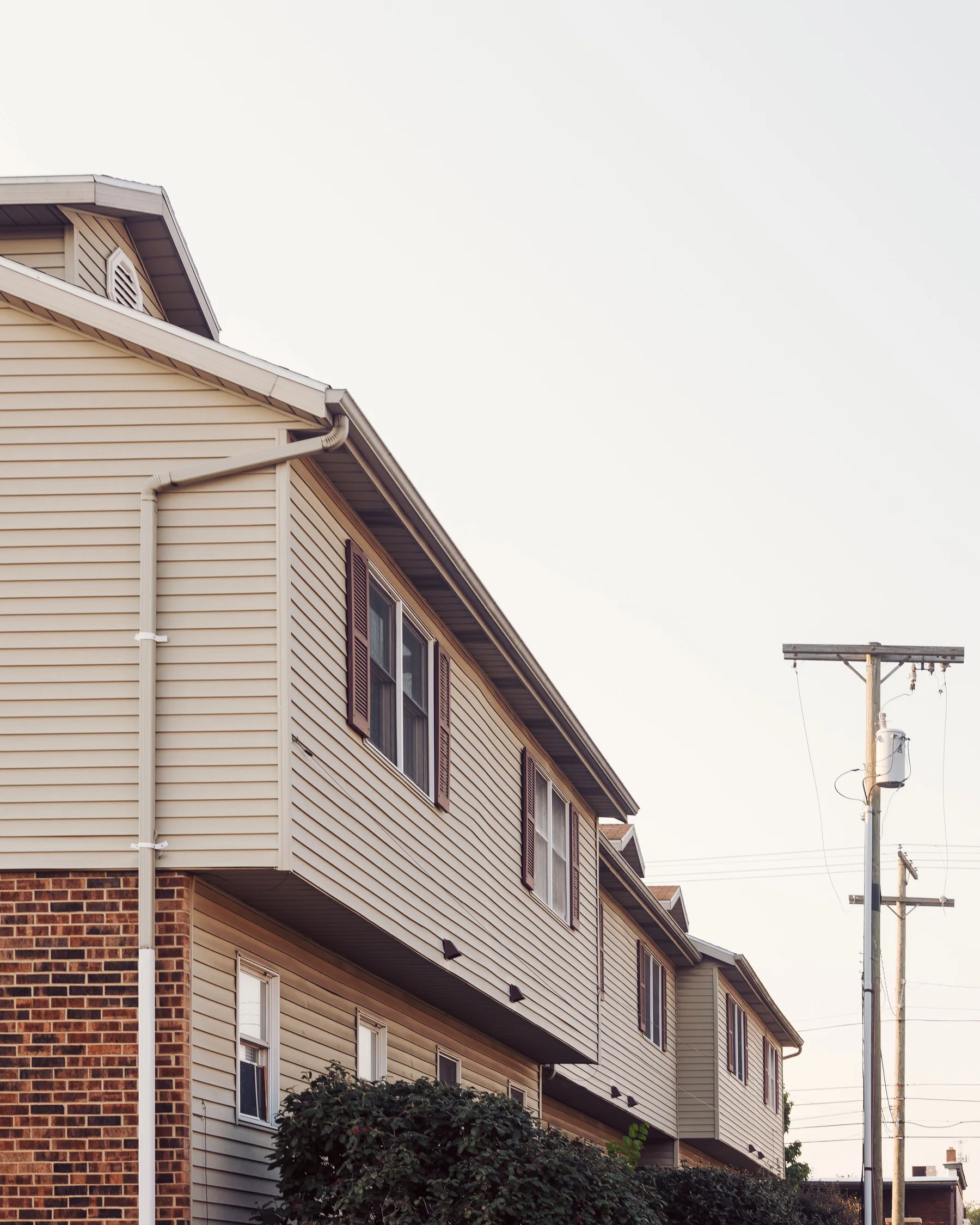 Attached residential townhomes representing an acquisition-stage investment property.
